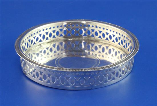 An early 19th century French pierced 950 standard silver wine coaster, 2.5 oz.